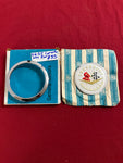 1956-57 CHEVROLET NOS CORVETTE REAR EMBLEM AND BEZEL